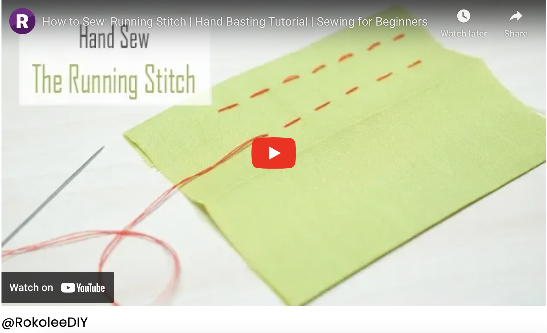 A person comparing their body measurements written on a notepad to a sewing pattern's size chart.