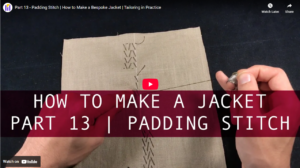 Hand pad stitching on tailored jacket collar showing diagonal rows of small stitches creating permanent shape